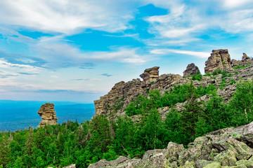 Fototapeta na wymiar rocks on the top of the mountain in the russian taiga