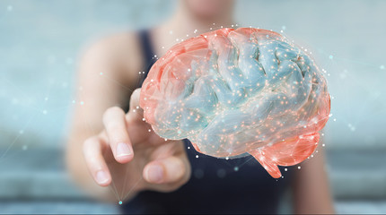 Businesswoman using digital 3D projection of a human brain 3D rendering