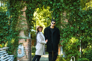 Fototapeta premium young couple in love on the streets of the autumn city . Young men in coats