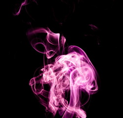 Purple smoke on black background