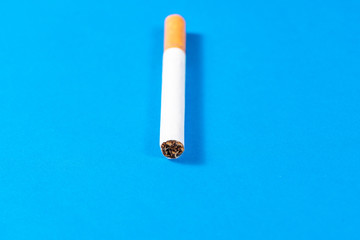 Tobacco Cigarette close up with blue background