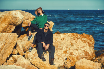 Young, hip couple in my coat . Couple in love in autumn