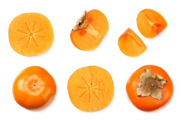 fresh ripe persimmons with slices isolated on white background. top view