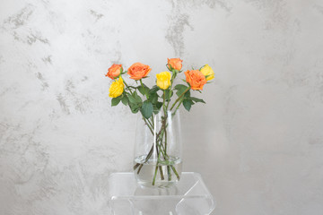 yellow roses in glass vase
