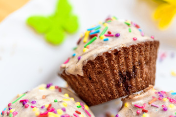 Muffin with glaze and sprinkles close-up