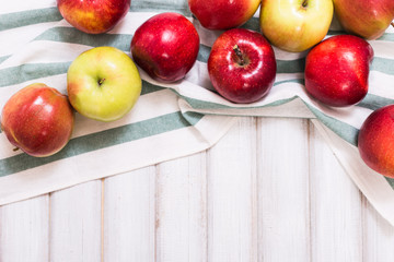 Sweet apples on wooden background