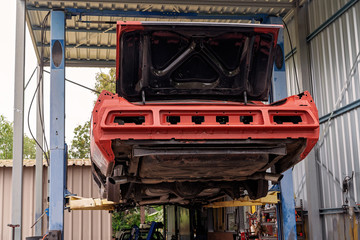 Back Of Old Car On A Hoist