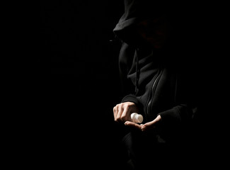 Female junkie taking drugs on dark background. Concept of addiction