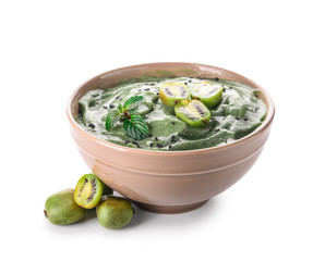 Bowl with tasty spirulina smoothie on white background