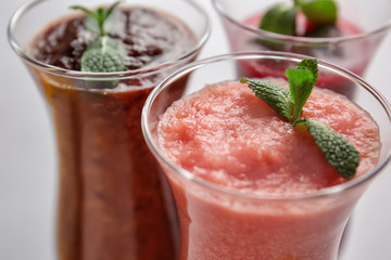 Glasses of tasty smoothies, closeup