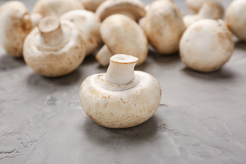 Fresh mushrooms on grey table