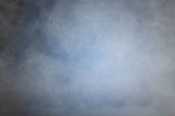 Obraz na płótnie Canvas Smoke or mist or fog over dark background. Abstract background.