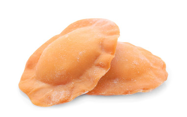 Raw ravioli on white background