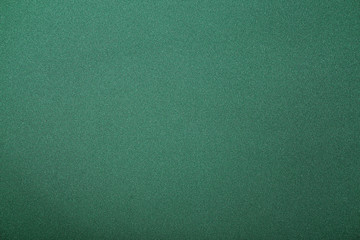 Green poker table, closeup