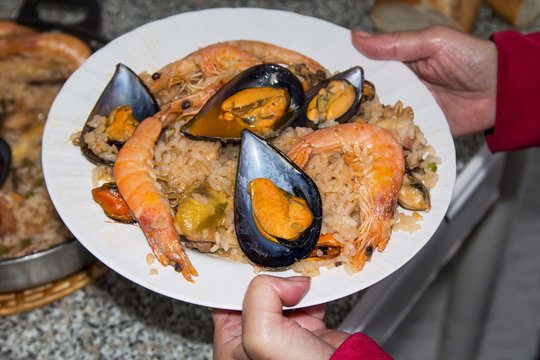 cooking rice with seafood, paella marinera