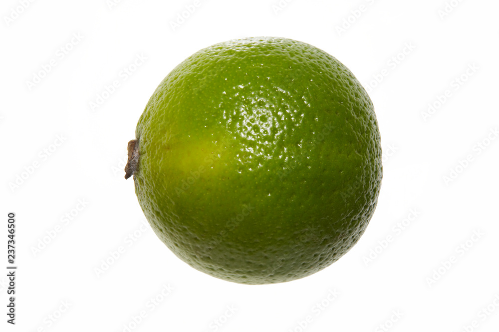 Wall mural whole fresh lime isolated on white background