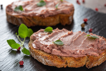 Open sandwiches with pate specialty made from pork and turkey liver with sweet cranberry jam