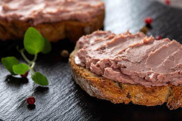 Fototapeta na wymiar Open sandwiches with pate specialty made from pork and turkey liver with sweet cranberry jam