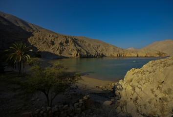 Obraz premium Lake among the rocks. Blue sky
