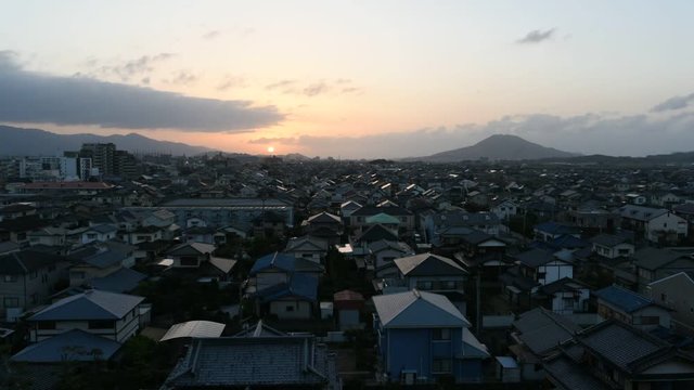 sunset over city timelapse Fukuoka, Japan