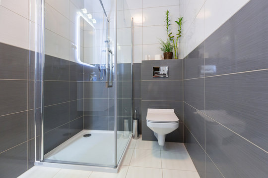 New bathroom interior with glass shower cabin
