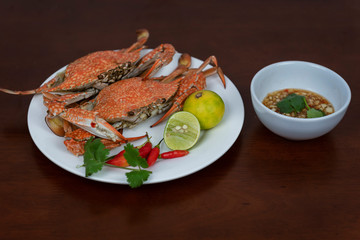 Blue crabs with Thai seafood dipping sauce on a plate