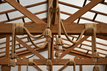 wood structure and rope decorated with lighting
