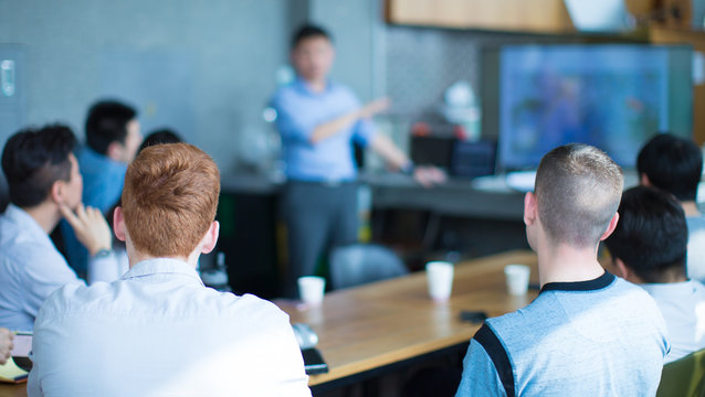 Group of People Meet During Education Session. Students Listen to Teacher's Presentation During Seminar at Speaker Development Meeting. University Classroom Presenter to Graduate Students. MBA Phd