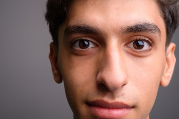 Obraz premium Close up of young handsome Persian teenage boy face