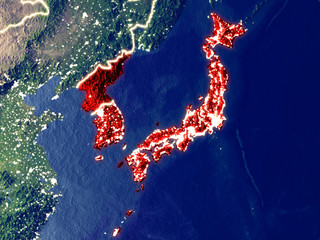 Japan and Korea from space on Earth at night. Very fine detail of the plastic planet surface with bright city lights.