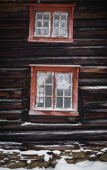 Wooden architecture, window motive. Old wooden house.