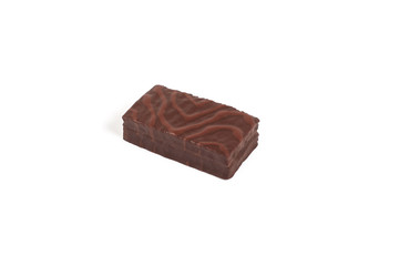 Sponge chocolate cake with cream filling isolated on white background.