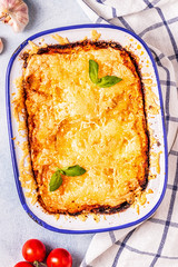 Traditional italian lasagna with vegetables, minced meat and cheese.