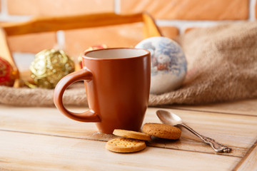 Morning cup of coffee with cookies on a wooden background. View from above.