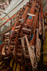 Plenty of polyester webbing lashing, lashing belts, straps and ratchets stowed in lashing container. Background.