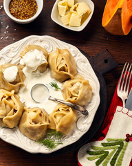 Asian steamed homemade dumplings Manti with pumpkin and garlic. Christmas or New Year dish. Top view.