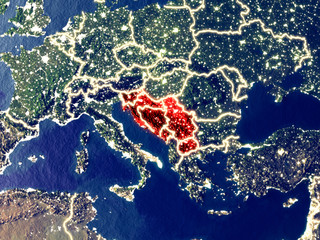 Former Yugoslavia from space on Earth at night. Very fine detail of the plastic planet surface with bright city lights.