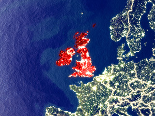 British Isles from space on Earth at night. Very fine detail of the plastic planet surface with bright city lights.