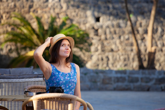Young attractive cheerful travel girl walking with camera