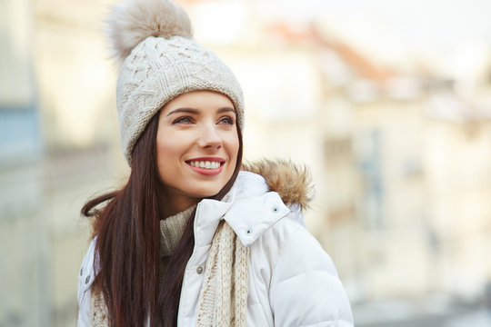 fashionable smiling woman in winter clothes