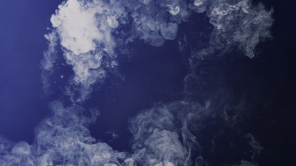 Blue toned . Fog and mist effect on black background. Smoke texture overlays.