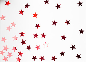 Group of red star decoration isolated on white background top view