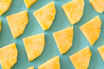 pattern of Sweet pineapple on blue background top view, flat lay