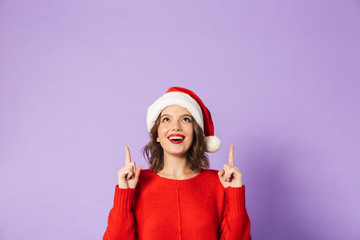 Happy young woman isolated over purple background.