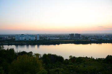 NIZHNY NOVGOROD, RUSSIA - AUGUST 28, 2018: View to Okskiy Bridge and lower city from Okskiy Syezd at time of sunset