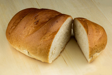 Crusty Bread Loaf on a Wooden Table Surface