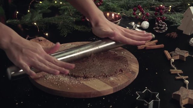 Rolling dough for Zimmtsterne on a rustical wooden cutting board