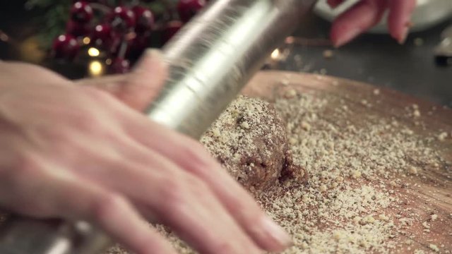 Rolling dough for Zimmtsterne on a rustical wooden cutting board