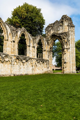 Fototapeta premium The ruins of the medieval St Mary's Abbey in the Museum Gardens in York, England. The abbey is a ruined Benedictine abbey and Grade 1 listed building