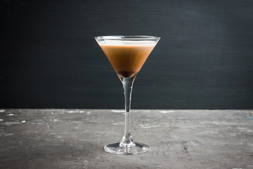 Chocolate martini with spices on the rustic background. Selective focus. Shallow depth of field.